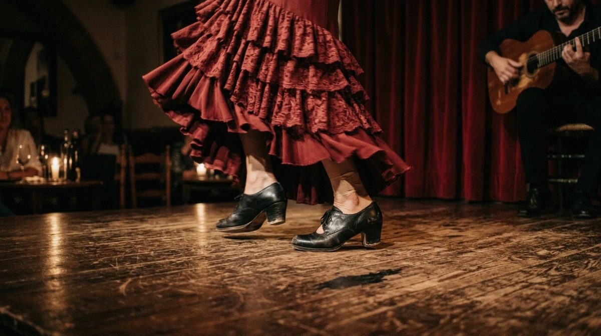 Dancer's feet and skirt on the wooden boards of a tablao during a flamenco show in Barcelona, Spain